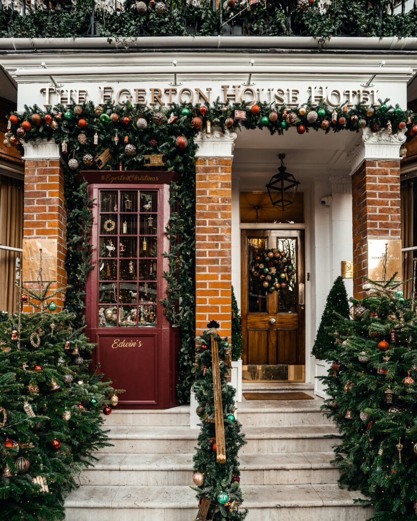 Hotel entrance with holiday decorations.