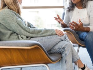 Two women discussing mental health.