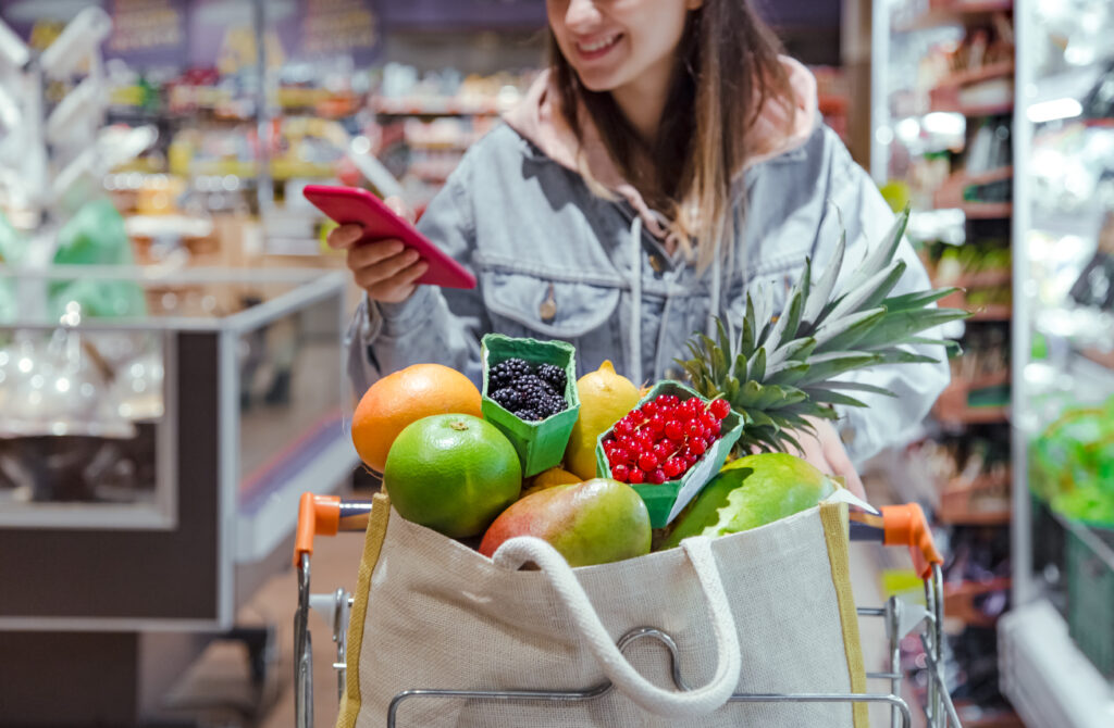 Woman using app to grocery shop