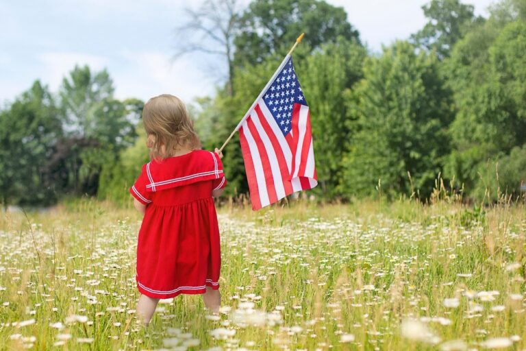 Child with flag celebrating memorial day