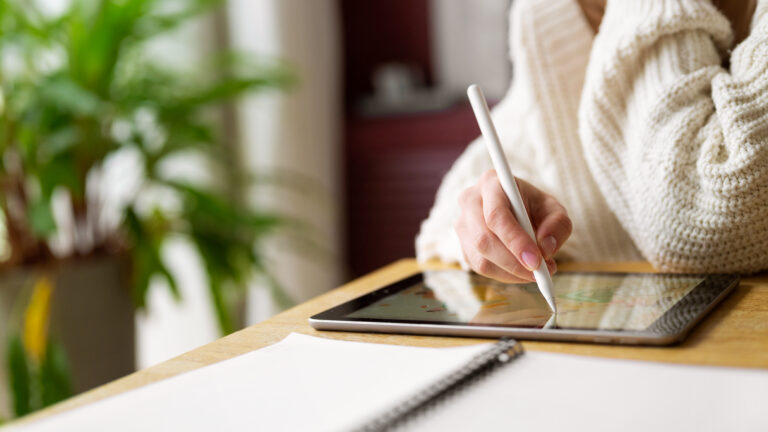 Mom creating her digital monthly planner.