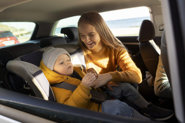 Mom checking her baby's car seat expiration date.