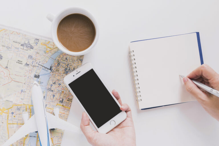 A person planning a trip using their phone trying to keep organized