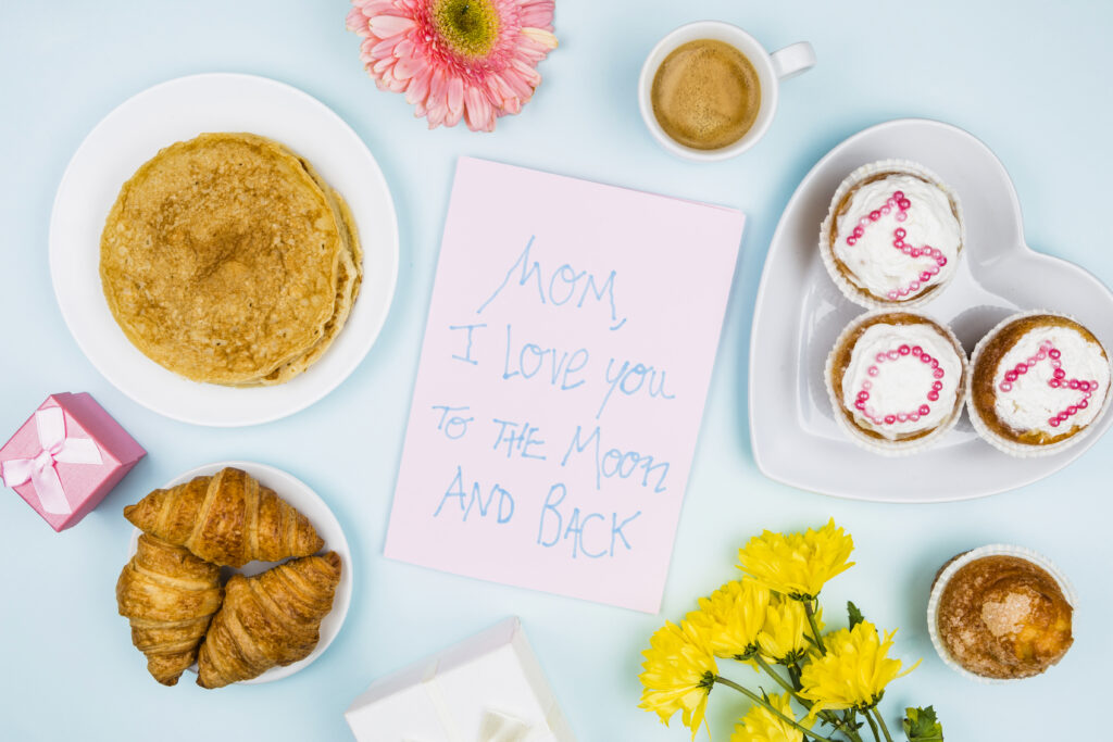 Mother's Day Brunch items including pancakes, muffin, coffee, and a note to mom