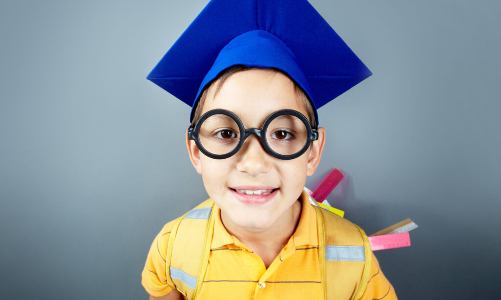 A kindergarten child that is about to receive the perfect graduation gift 