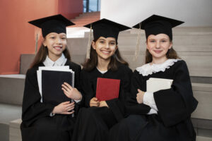 Elementary School girls that are graduating about to receive a gift